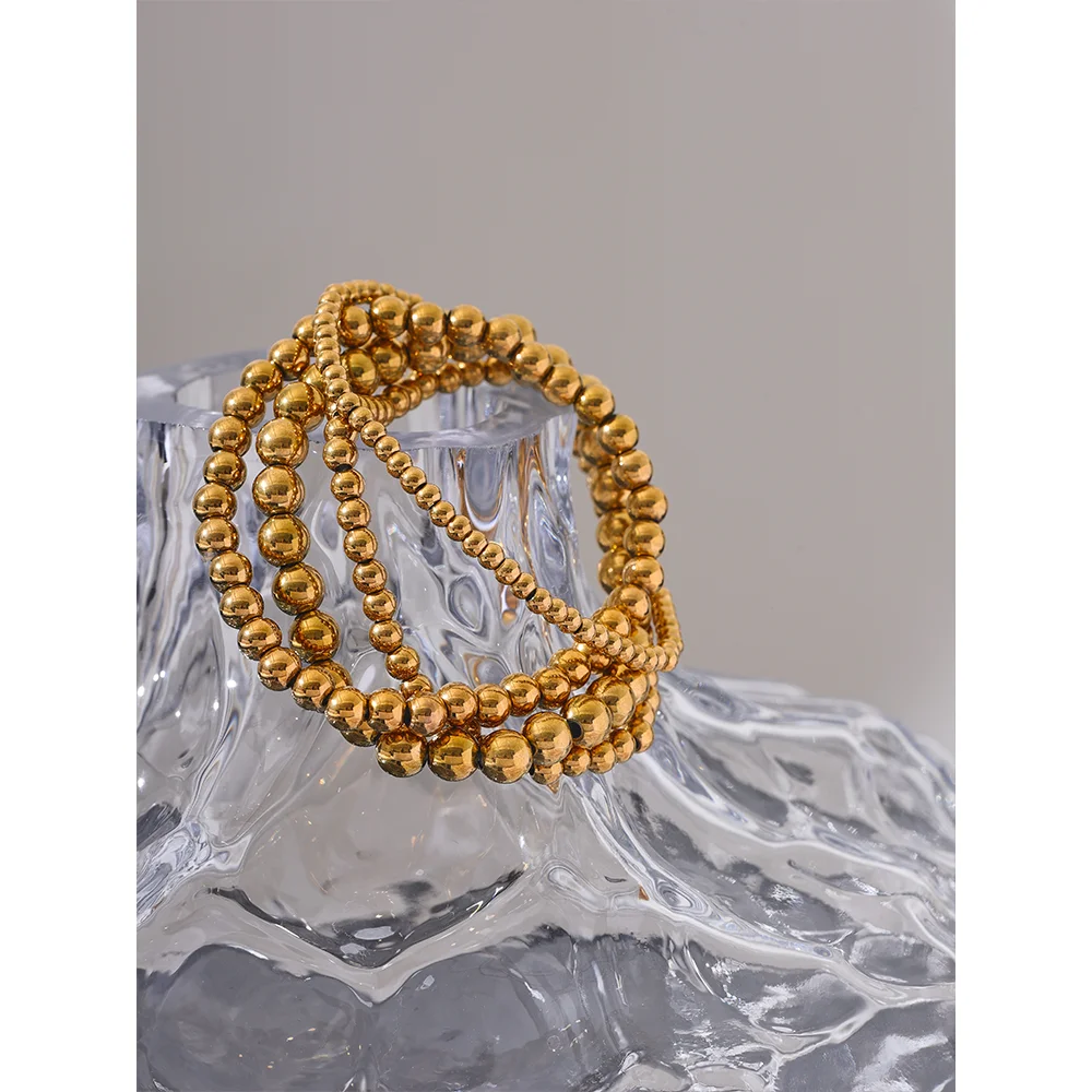 Pulseira esferas douradas